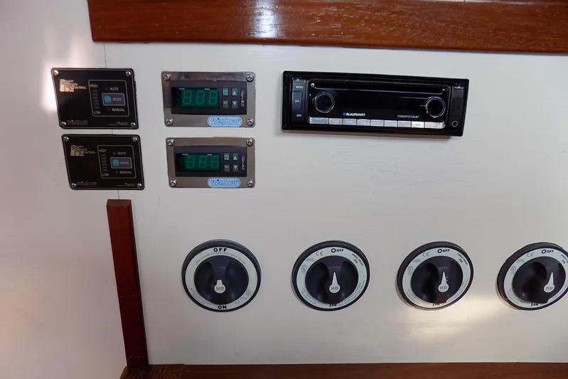 Yacht Photos Pics Control panel with Blaupunkt stereo and switches on a 2014 Custom Aluminum Expedition.