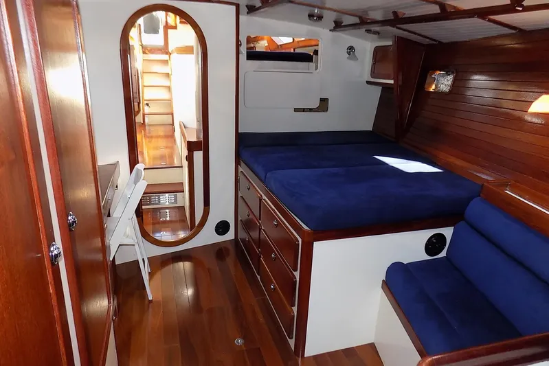  Yacht Photos Pics Luxurious 2014 Custom Aluminum Expedition yacht interior with wooden finish and blue upholstery.