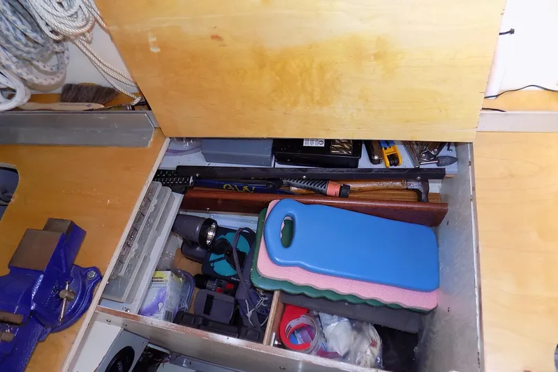  Yacht Photos Pics Storage compartment in a 2014 Custom Aluminum Expedition, containing tools and equipment.