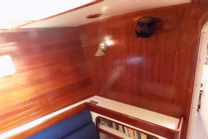  Yacht Photos Pics Cozy wooden interior of 2014 Custom Aluminum Expedition yacht with bookshelf and lighting.