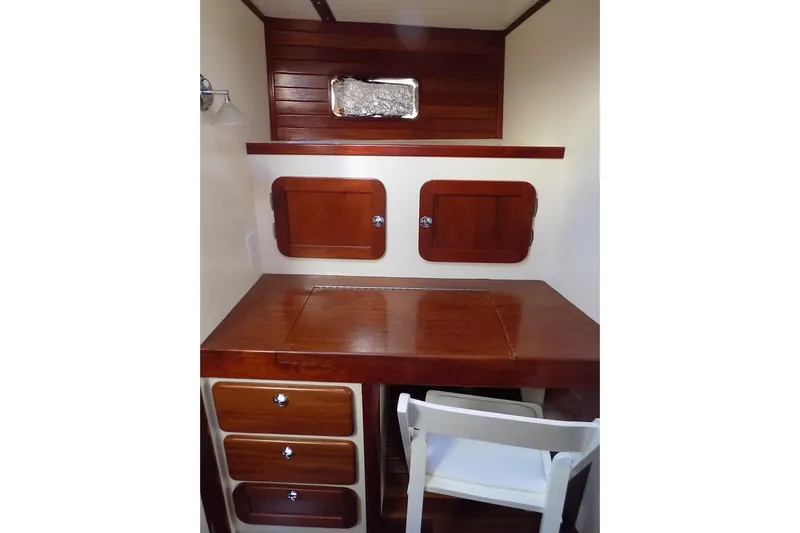  Yacht Photos Pics Wooden desk and storage in 2014 Custom Aluminum Expedition boat interior.