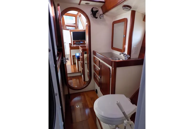  Yacht Photos Pics Interior of 2014 Custom Aluminum Expedition yacht with wooden cabinetry and compact bathroom.