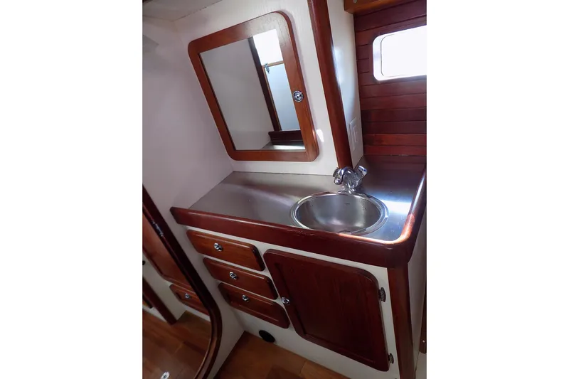  Yacht Photos Pics 2014 Custom Aluminum Expedition yacht bathroom with wood accents and stainless steel sink.