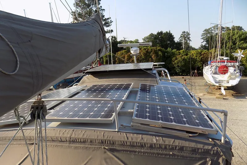  Yacht Photos Pics Custom 2014 Aluminum Expedition boat with solar panels and radar, docked outdoors.