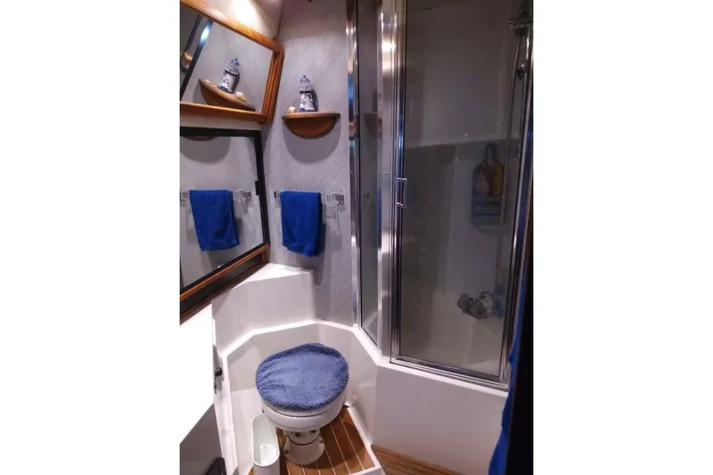  Yacht Photos Pics Bathroom interior of 1991 Bayliner 4588 Pilothouse with shower and toilet.