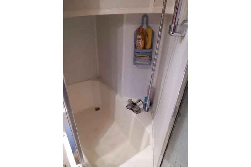  Yacht Photos Pics Shower area in 1991 Bayliner 4588 Pilothouse yacht with toiletries and fixtures.