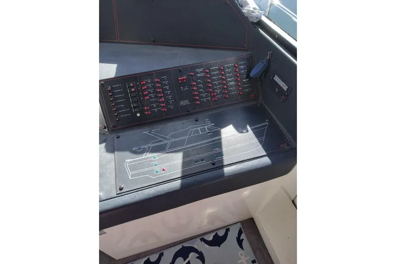 Yacht Photos Pics 1991 Bayliner 4588 Pilothouse control panel with switches and diagram.