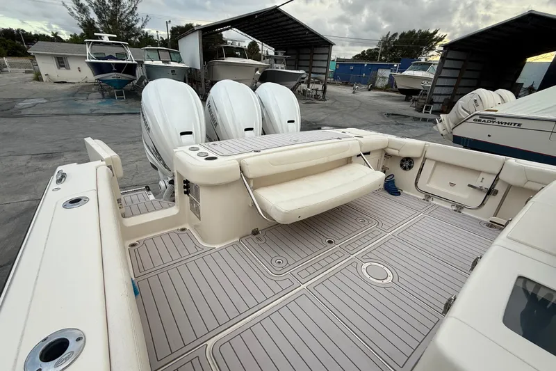 336-420 Brokerage Tyler Yacht Photos Pics 2020 Grady-White Canyon 336 boat with triple outboard engines in a marina setting.