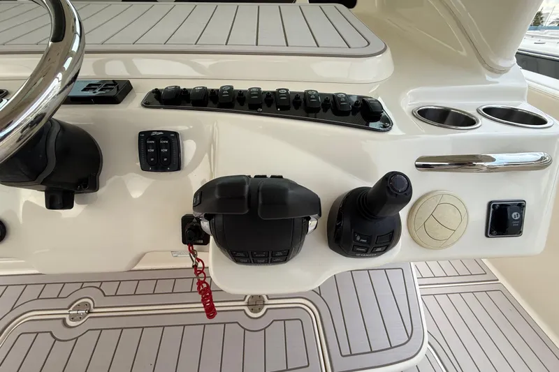 336-420 Brokerage Tyler Yacht Photos Pics Control panel of 2020 Grady-White Canyon 336 boat with steering wheel and switches.
