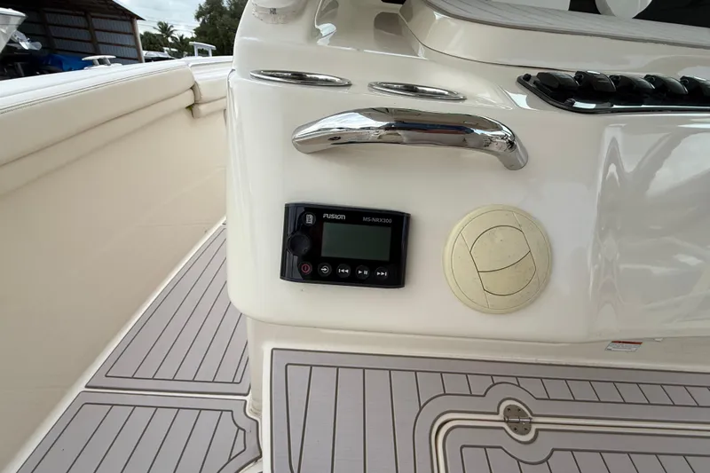 336-420 Brokerage Tyler Yacht Photos Pics 2020 Grady-White Canyon 336 boat interior with Fusion audio system and sleek design.