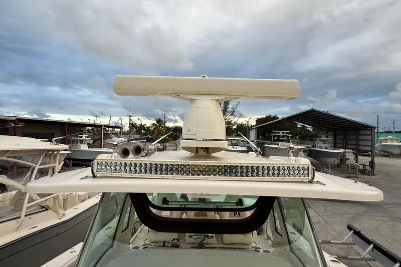 336-420 Brokerage Tyler Yacht Photos Pics 2020 Grady-White Canyon 336 boat with radar and LED light bar, docked under cloudy skies.