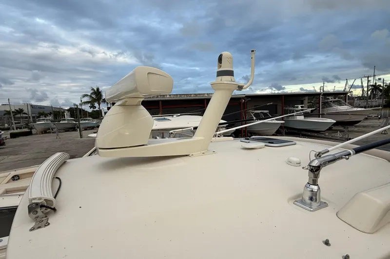 336-420 Brokerage Tyler Yacht Photos Pics 2020 Grady-White Canyon 336 boat radar and equipment on deck, marina background.