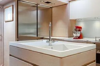 Thalima Yacht Photos Pics Luxurious kitchen interior of 2010 Southern Wind SW110 yacht with modern fixtures.