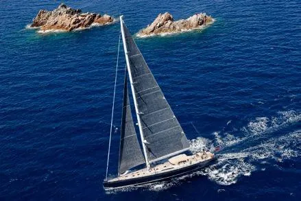 Thalima Yacht Photos Pics Sailing yacht Southern Wind SW110, 2010, cruising near rocky islands in clear blue waters.