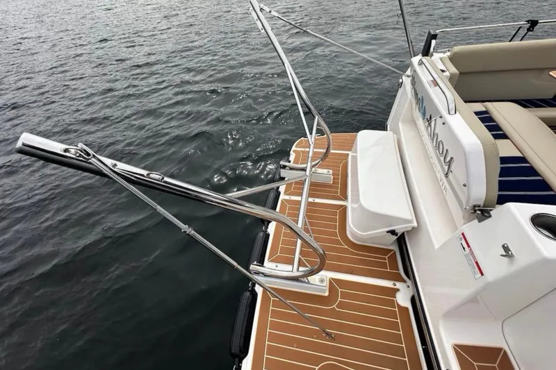 Flips Ahoy Yacht Photos Pics 2021 Ranger Tugs R-29 S boat deck with stainless steel railings on water.