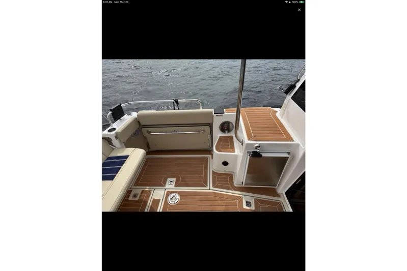 Flips Ahoy Yacht Photos Pics 2021 Ranger Tugs R-29 S boat deck with seating and wood finish.