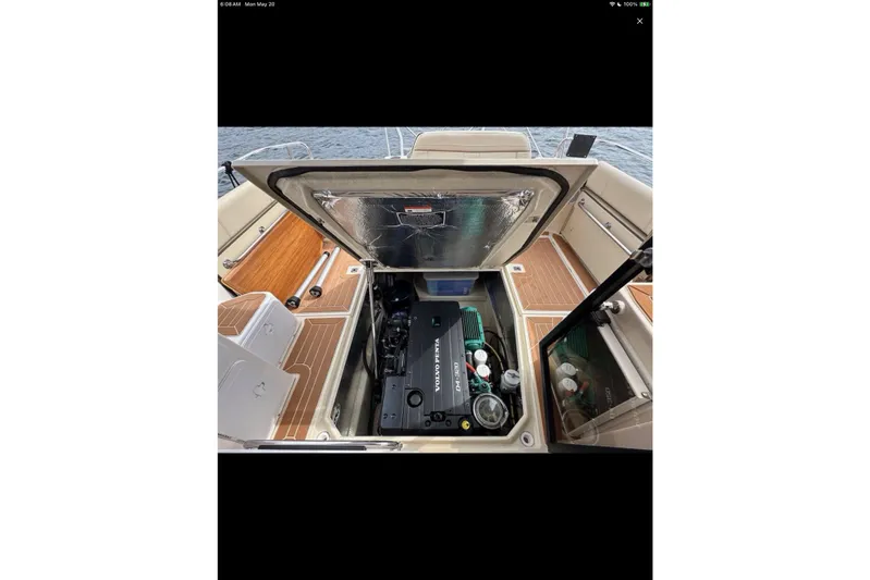 Flips Ahoy Yacht Photos Pics 2021 Ranger Tugs R-29 S engine compartment with open hatch, showcasing interior details.