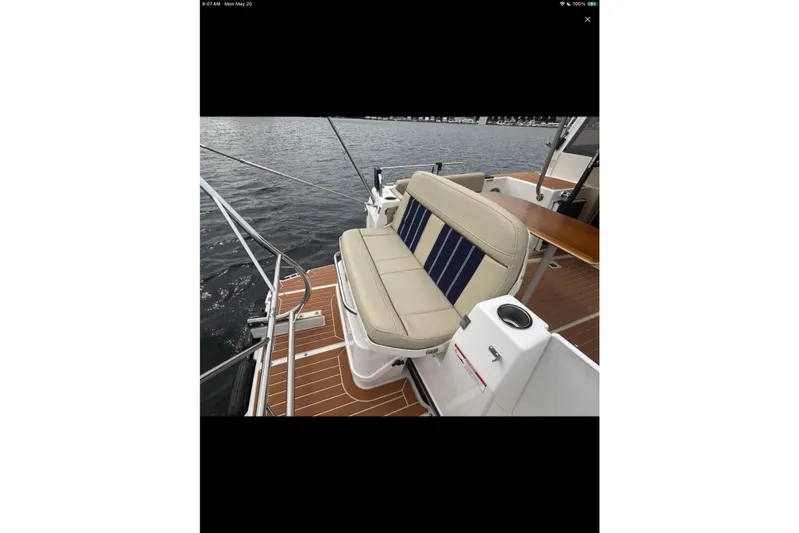 Flips Ahoy Yacht Photos Pics 2021 Ranger Tugs R-29 S boat with cushioned seating on deck.