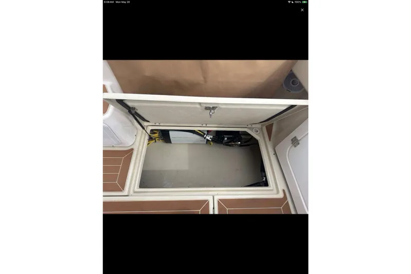 Flips Ahoy Yacht Photos Pics 2021 Ranger Tugs R-29 S engine compartment with open hatch, showcasing interior components.