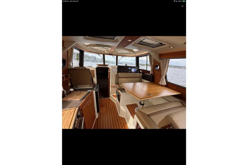 Flips Ahoy Yacht Photos Pics Interior of 2021 Ranger Tugs R-29 S boat with elegant wood finishes and seating.