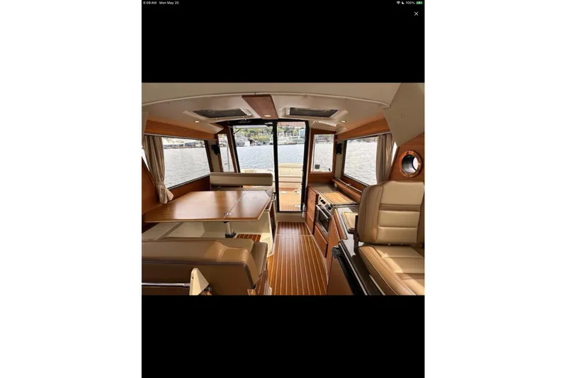 Flips Ahoy Yacht Photos Pics Interior of 2021 Ranger Tugs R-29 S, featuring elegant wood finishes and spacious seating.