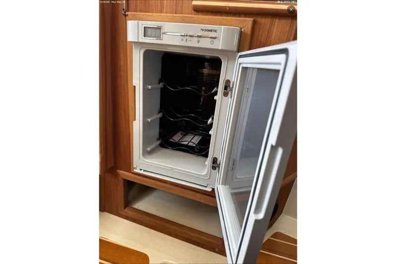 Flips Ahoy Yacht Photos Pics Open Dometic fridge inside 2021 Ranger Tugs R-29 S boat interior.