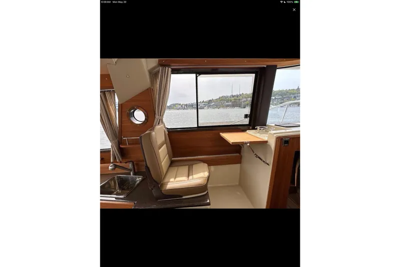 Flips Ahoy Yacht Photos Pics Interior of 2021 Ranger Tugs R-29 S with window view and seating area.