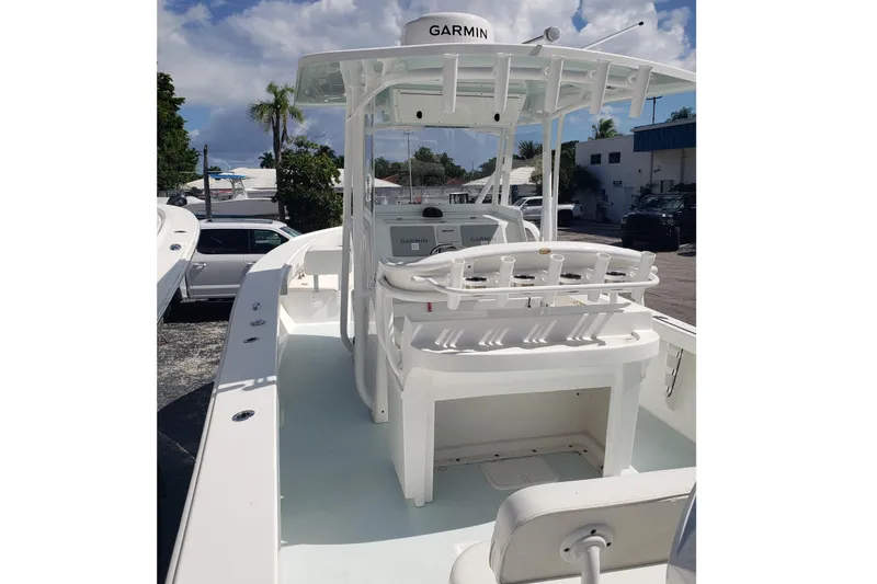 27 Albury Brothers Yacht Photos Pics 2022 Albury Brothers 27 boat with Garmin equipment, docked under a clear sky.