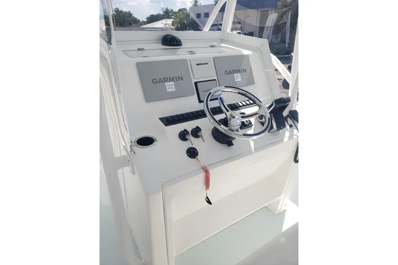 27 Albury Brothers Yacht Photos Pics 2022 Albury Brothers 27 boat console with Garmin navigation and steering wheel.