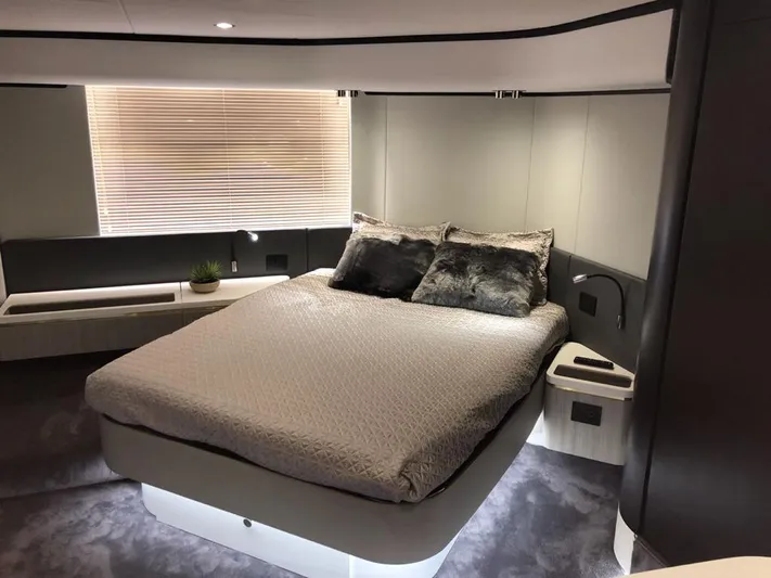  Yacht Photos Pics Luxurious bedroom interior of 2018 Azimut 55 yacht with modern design and cozy bedding.