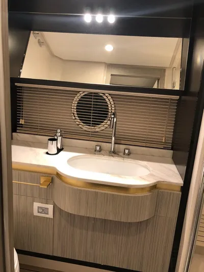  Yacht Photos Pics Luxurious bathroom interior of a 2018 Azimut 55 yacht with modern fixtures.