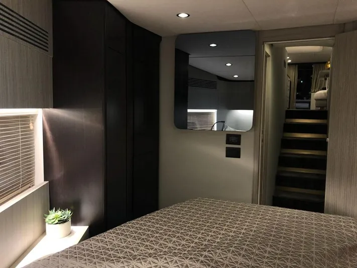  Yacht Photos Pics Luxurious interior of 2018 Azimut 55 yacht bedroom with modern decor and ambient lighting.