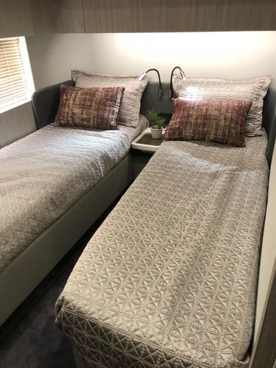  Yacht Photos Pics Twin beds in a 2018 Azimut 55 yacht cabin with modern decor.