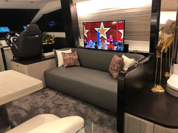  Yacht Photos Pics Luxurious interior of a 2018 Azimut 55 yacht with modern decor and entertainment system.