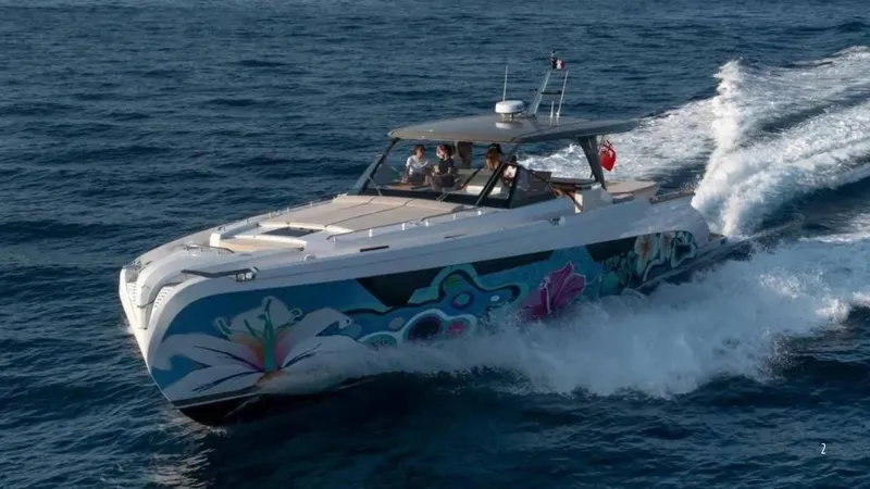  Yacht Photos Pics 2024 Franchini 63 yacht cruising on open sea with vibrant hull artwork.