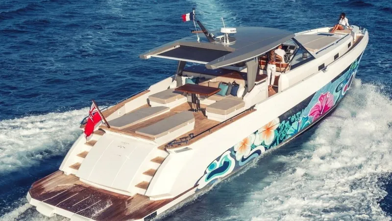  Yacht Photos Pics Luxurious 2024 Franchini 63 yacht with vibrant floral design cruising on open water.
