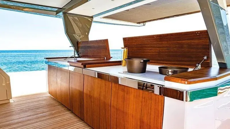  Yacht Photos Pics Luxurious outdoor kitchen on 2024 Franchini 63 yacht with ocean view.