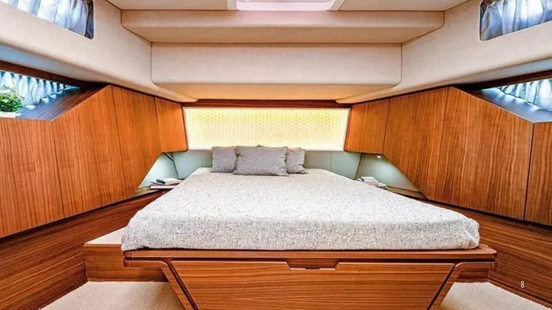  Yacht Photos Pics Luxurious cabin interior of 2024 Franchini 63 yacht with elegant wood paneling and cozy bedding.