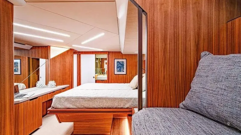  Yacht Photos Pics Luxurious 2024 Franchini 63 yacht interior with elegant wood paneling and cozy seating.