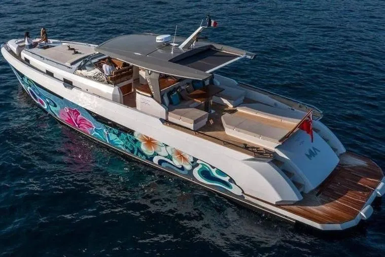  Yacht Photos Pics Luxurious 2024 Franchini 63 yacht with vibrant floral hull design cruising on open water.