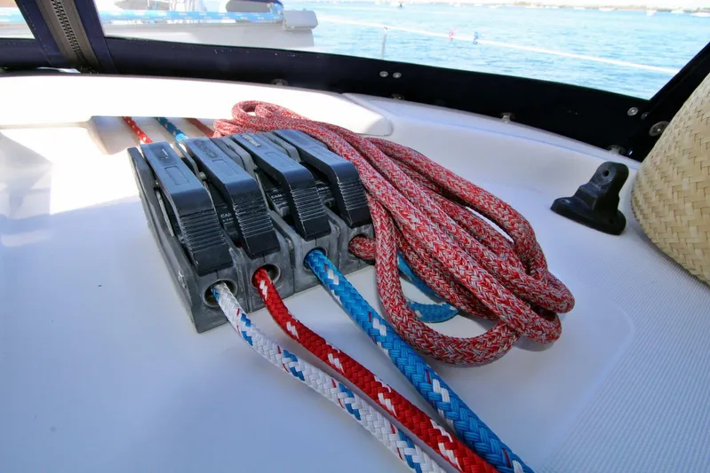  Yacht Photos Pics Colorful ropes and cam cleats on a 2003 Beneteau 473 sailboat deck.