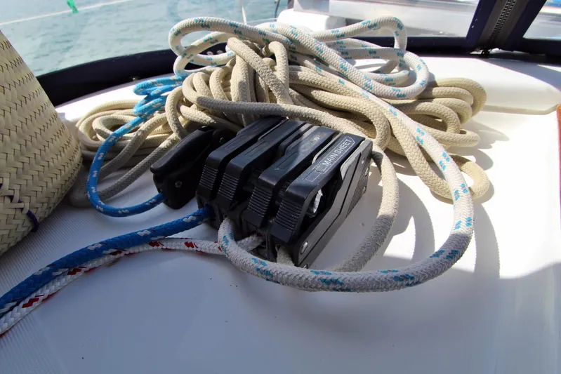  Yacht Photos Pics Rope and mainsheet clutch on 2003 Beneteau 473 sailboat deck.
