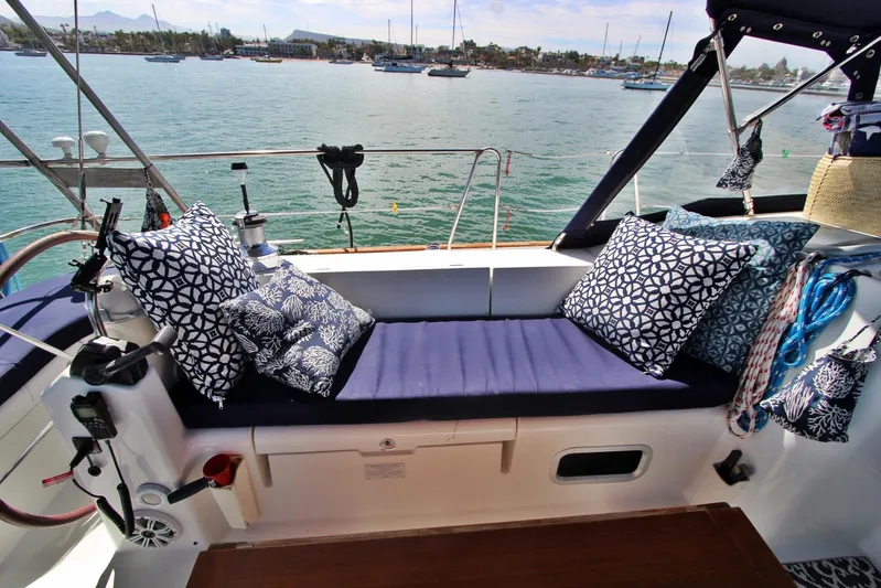  Yacht Photos Pics Cozy seating area on a 2003 Beneteau 473 sailboat with patterned cushions.