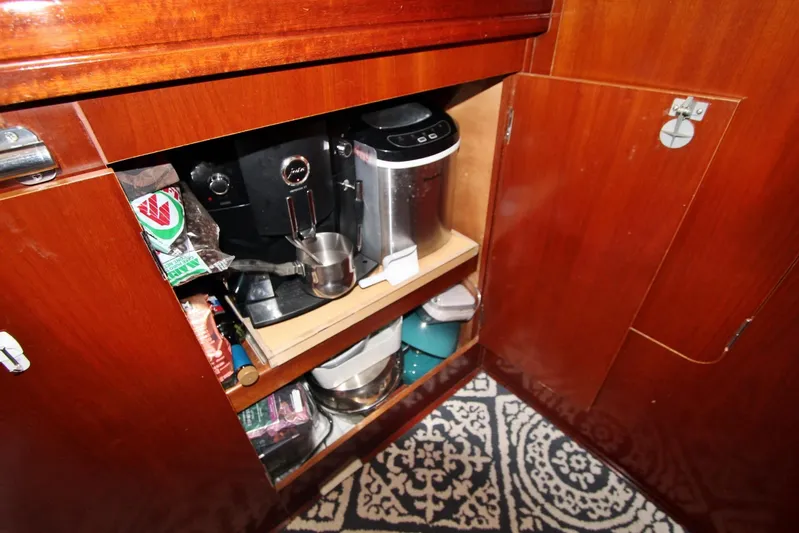  Yacht Photos Pics Cabinet interior on 2003 Beneteau 473 yacht with coffee maker and supplies.