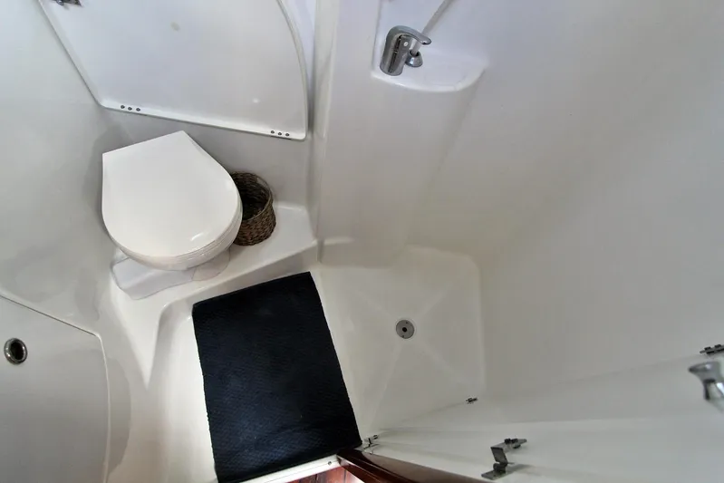  Yacht Photos Pics Bathroom interior of 2003 Beneteau 473 yacht, featuring toilet and shower area.