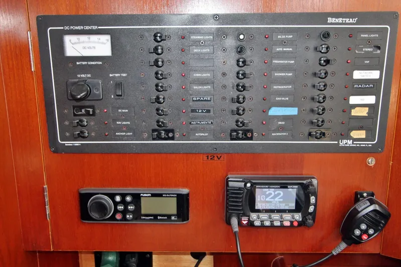  Yacht Photos Pics Electrical control panel on a 2003 Beneteau 473 yacht, featuring various switches and displays.