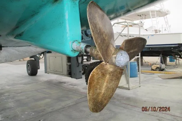  Yacht Photos Pics Propeller of 2003 Beneteau 473 sailboat in dry dock, showing wear and maintenance needs.