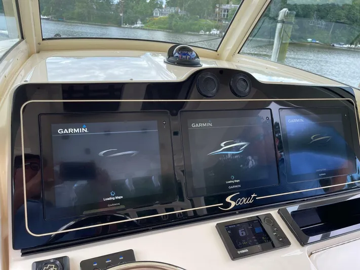  Yacht Photos Pics 2016 Scout 350 LXF boat dashboard with Garmin navigation screens and Yamaha controls.