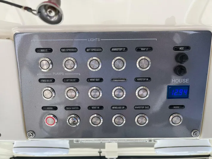  Yacht Photos Pics Control panel of a 2016 Scout 350 LXF boat with various switches and digital display.