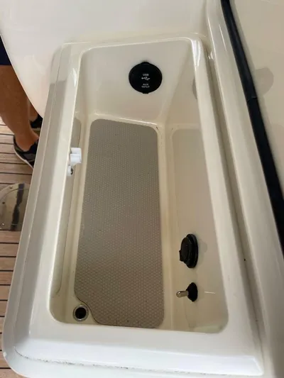  Yacht Photos Pics Storage compartment with USB and AUX input on a 2016 Scout 350 LXF boat.